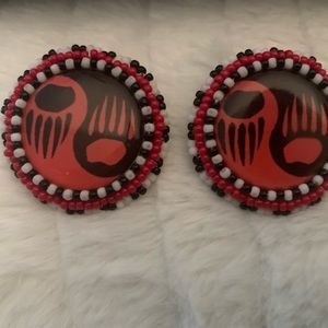 Leather and beaded around orange , black and white round earrings.bear paw A.I